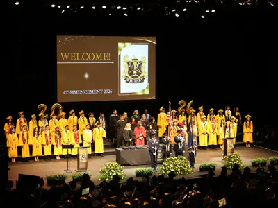 students on stage for a graduation